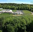 4.6 Acres With Commercial Greenhouses In Prime Location