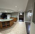 Basement Duplex Delight: Modern 1-Bedroom With Den On Elm St!