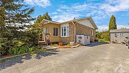 Charming 2+1 Bdrm  Home On A Private, Spacious Lot