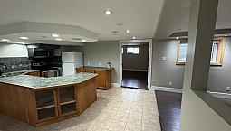 Basement Duplex Delight: Modern 1-Bedroom With Den On Elm St!